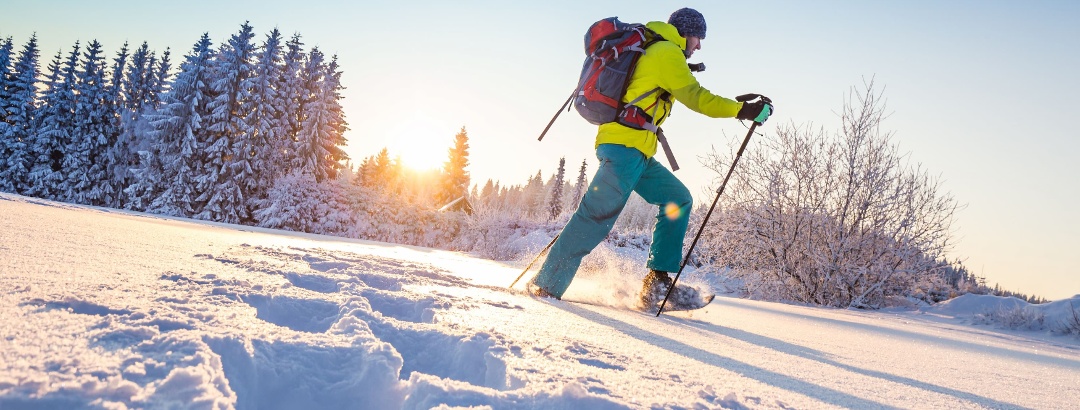 Snowshoeing in the untouched winter mountains